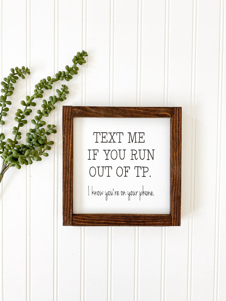 Text me if you run out of TP. I know you're on your phone framed wooden bathroom sign. Cute/Funny farmhouse framed bathroom sign decor.