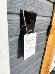 No Soliciting. Friends, call or text us when you arrive. Please remove your shoes at the door. Small front door sign. Hanging porch sign