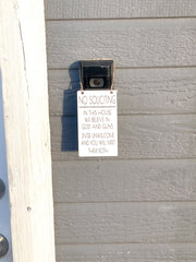 No soliciting / In this house we believe in God and guns. Enter unwelcome and you will meet them both / Protective hanging doorbell sign