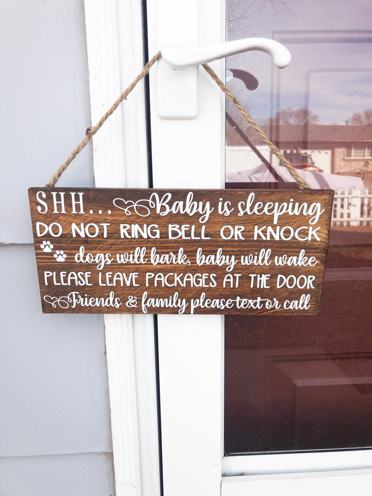 Shh baby is sleeping do not ring bell or knock, dogs will bark, baby will wake, please leave packages at the door.. wooden front door sign