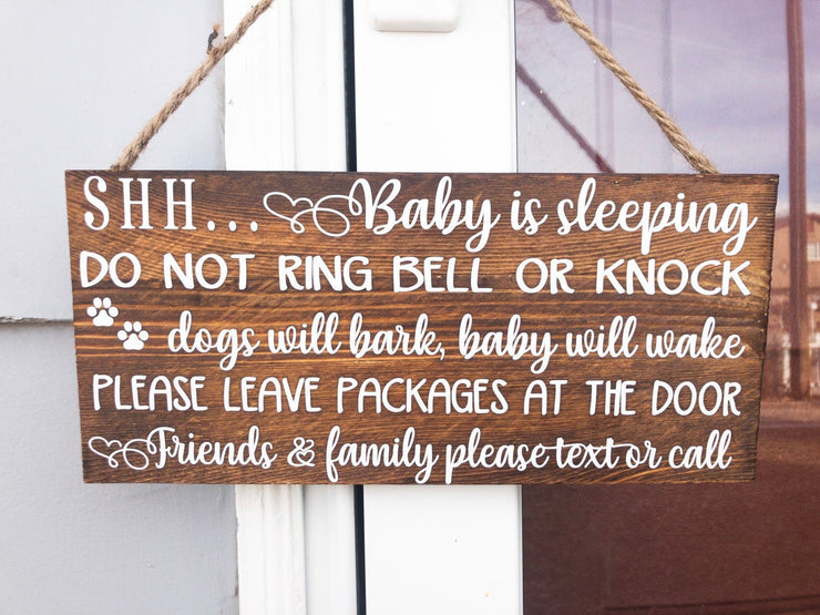 Shh baby is sleeping do not ring bell or knock, dogs will bark, baby will wake, please leave packages at the door.. wooden front door sign