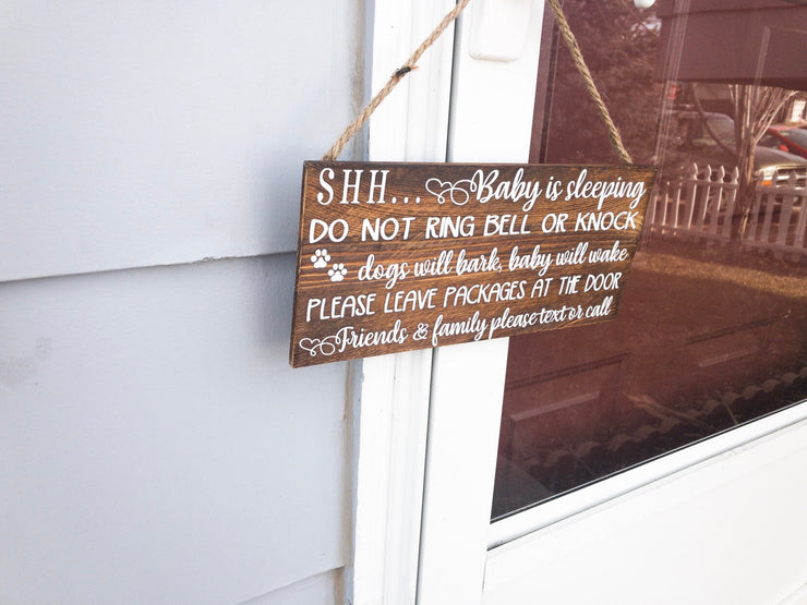 Shh baby is sleeping do not ring bell or knock, dogs will bark, baby will wake, please leave packages at the door.. wooden front door sign