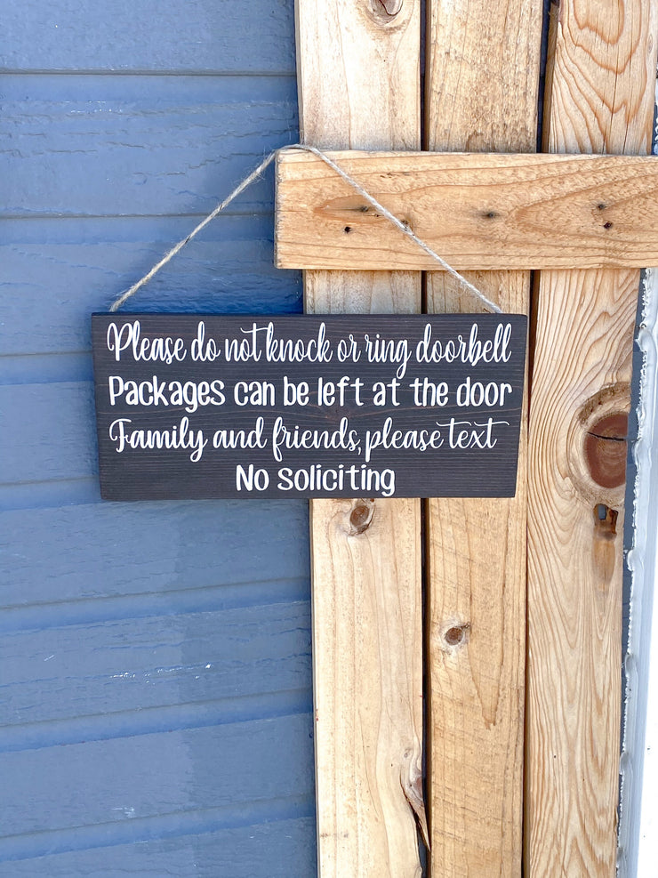 Please do not knock or ring doorbell sign / Packages can be left at the door / Family and Friends please text / No soliciting door sign