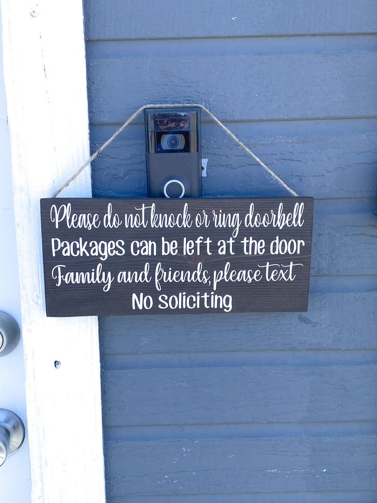 Please do not knock or ring doorbell sign / Packages can be left at the door / Family and Friends please text / No soliciting door sign