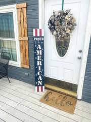 Proud to be an American with stars and stripes. Painted 4th of July patriotic sign. Front door porch leaner sign. Red, white and blue sign